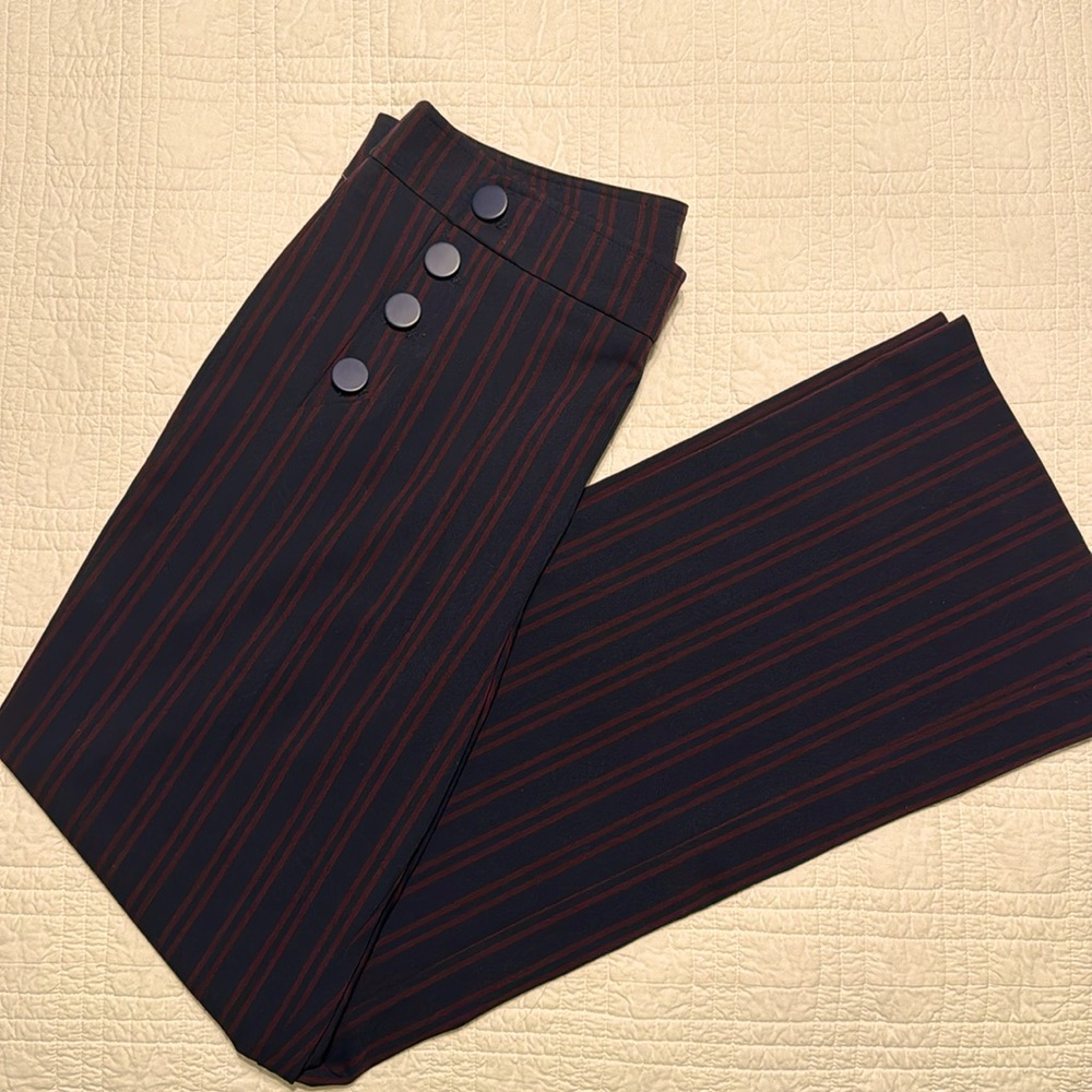Navy trousers with burgundy pinstripe.